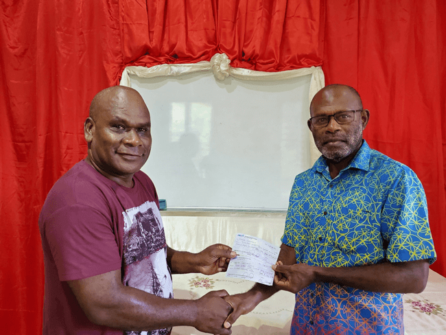 NISCOL Accountant presenting cheques for Vanuatu Government’s share and concession payment to Government’s Board of Directors representative.